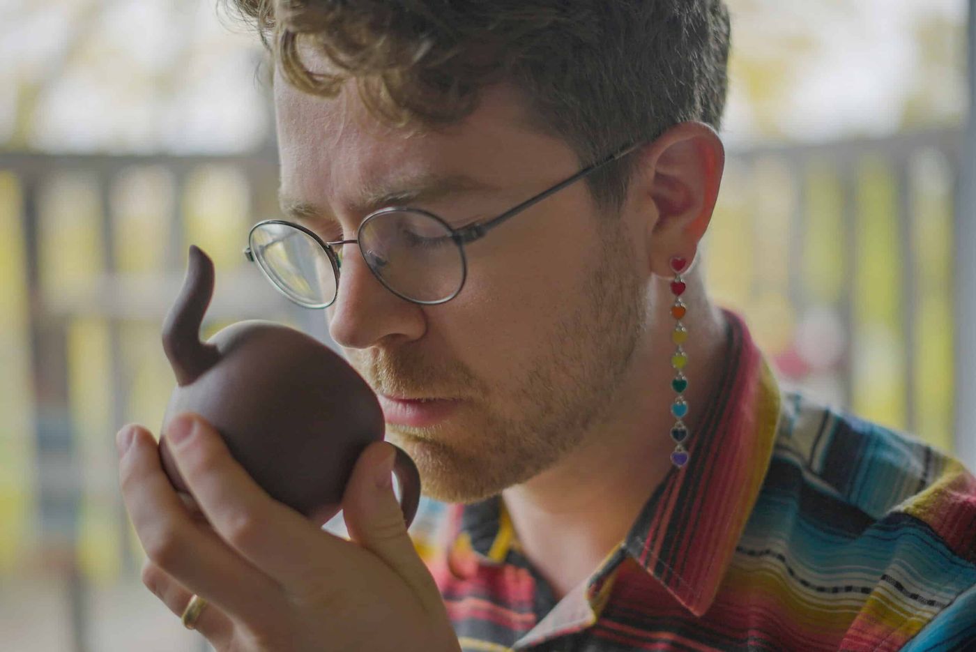 This is a picture of me smelling the warm tea leaves after brewing a pot in my yixing clay teapot.